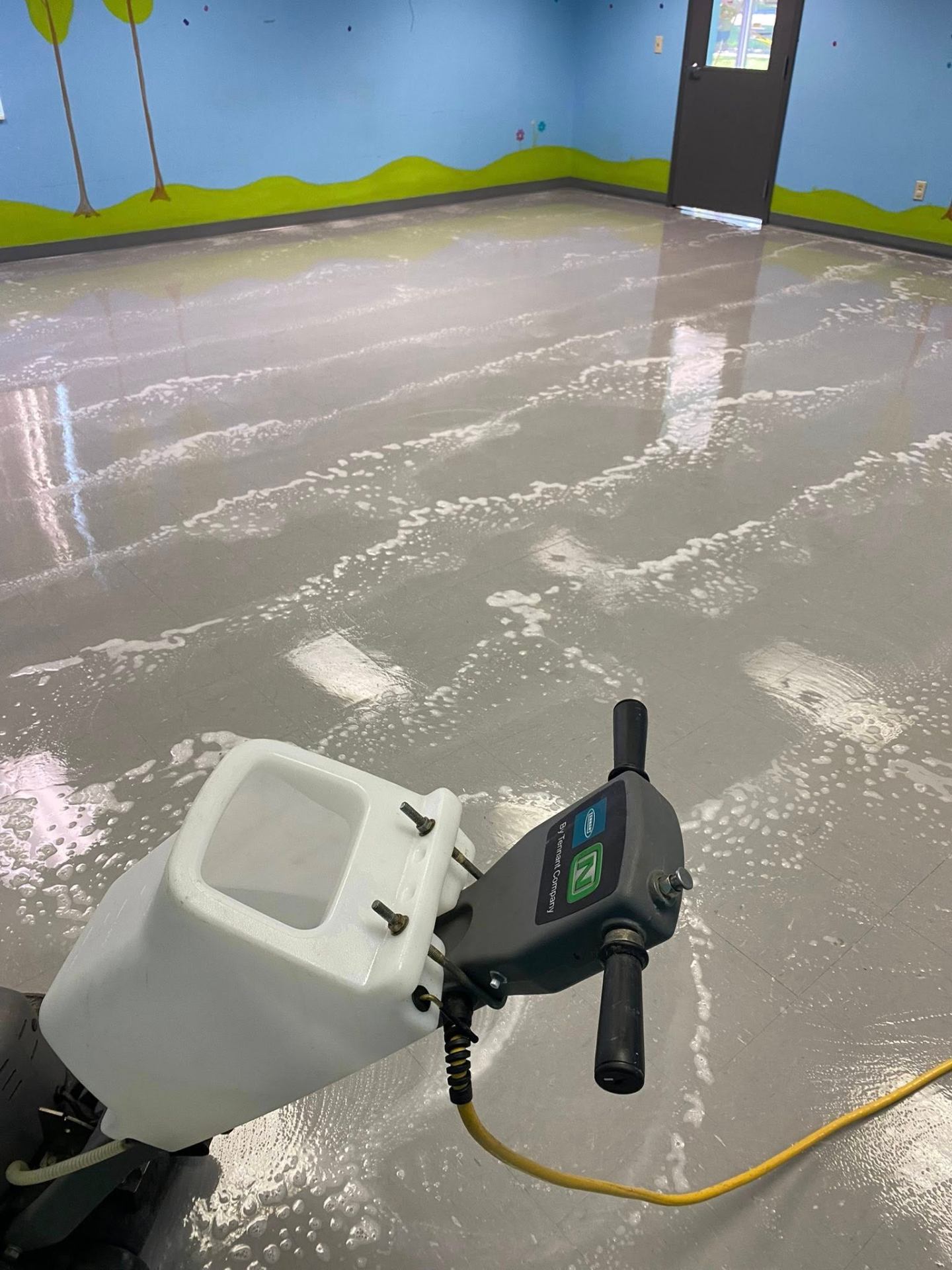 Stripping and waxing a VCT tile floor